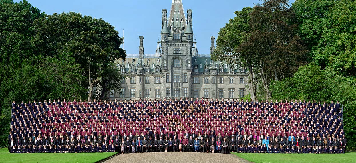 Whole school photograph with school building in background