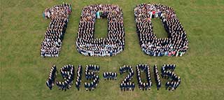 Aerial group photograph with pupils standing in the shape of the numbers "100 1915-2015"
